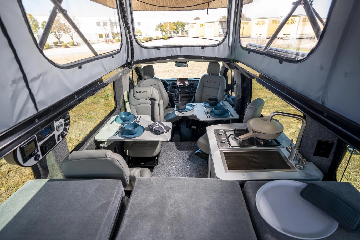 These pictures show ModVans' layout inside a CV1 camper, which comes with the standard two-burner gas stove, but the CV1/X comes with an induction cooktop as standard and runs all camper functions off the battery system