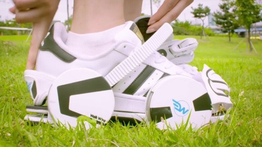 Each Walk Wing attaches to the user’s existing footwear via a heel strap, toe cover, and a ratcheting ankle strap