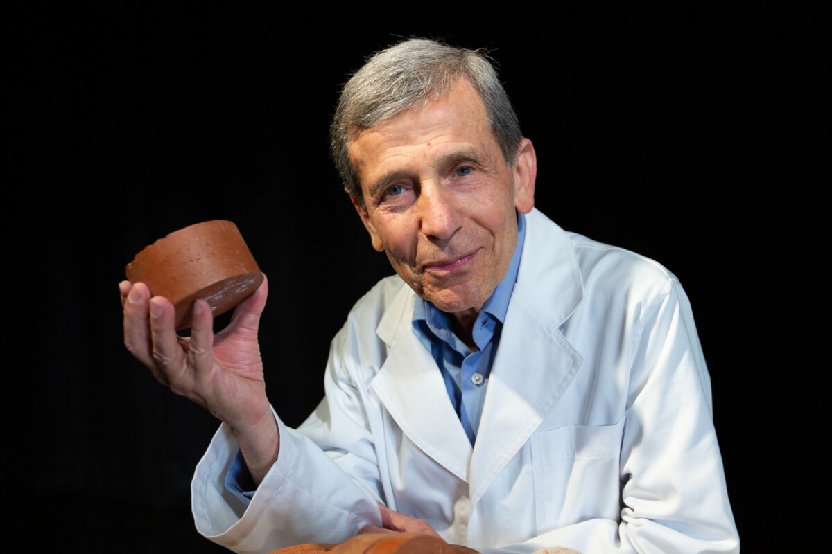 Lead scientist Abbas Mohajerani, with one of the biosolids bricks