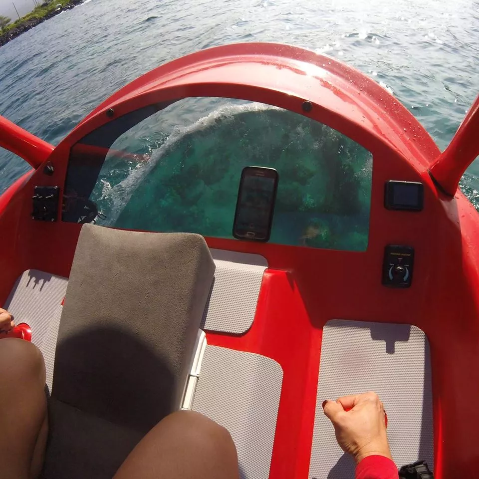 Users lie prone on the Aeon Explorer, looking down through an acrylic window in the underside of its nose