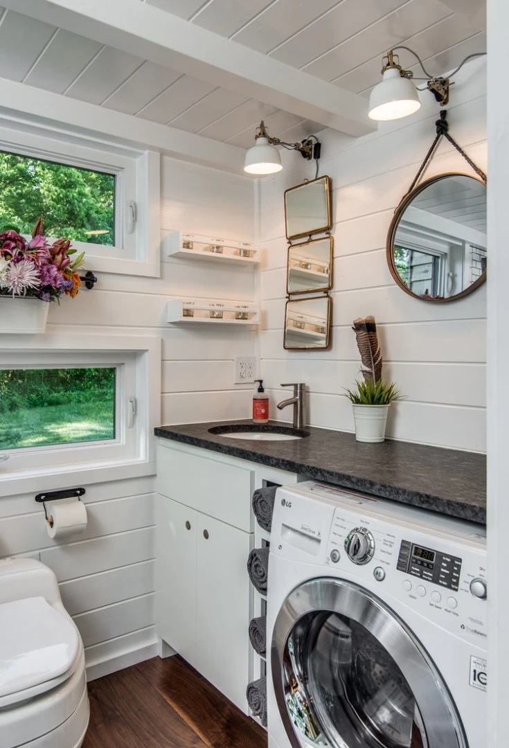 The bathroom also includes the washer/dryer