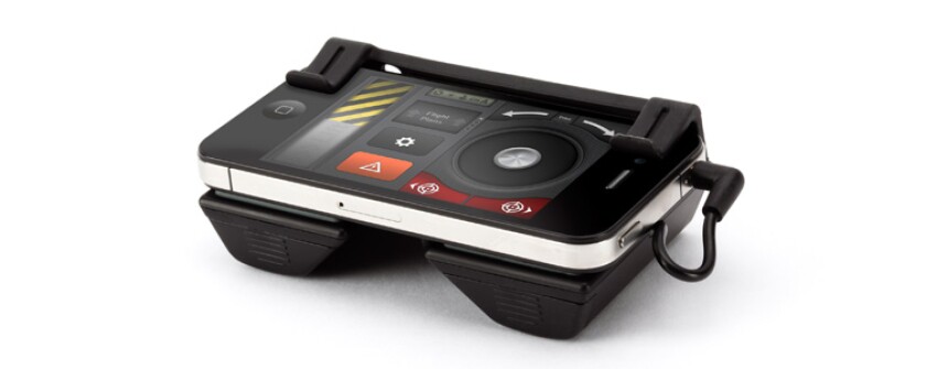 The HELO TC Assault comes with a Flight Deck that attaches to your mobile device, and sends commands to the chopper via infrared
