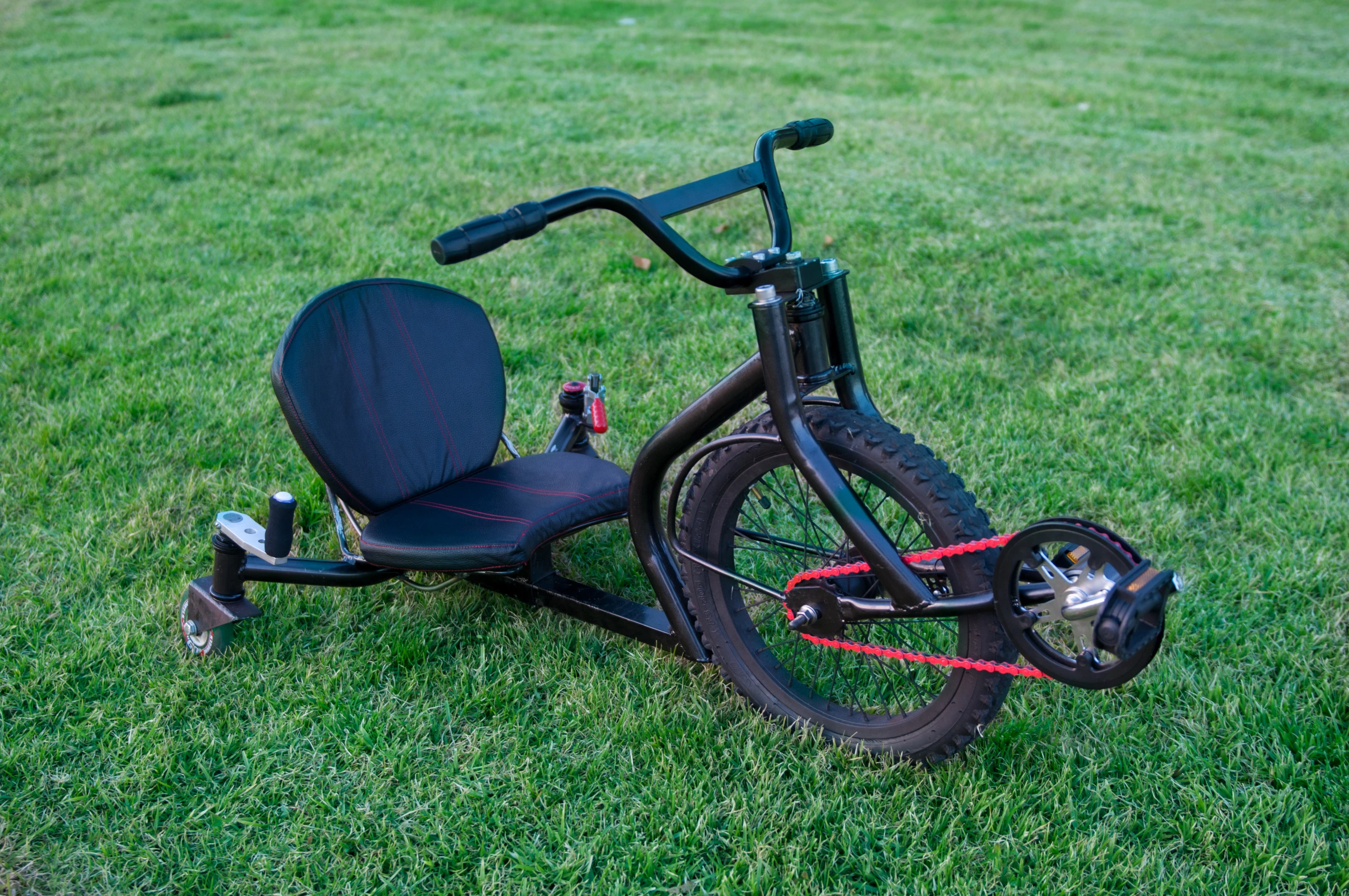 The custom leatherette seat between the back wheels sits about five inches off the ground for low center of gravity and stability