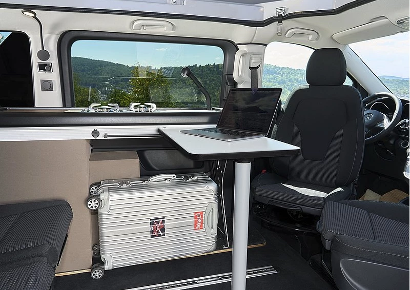 The open space below the kitchen can easily store luggage or be left empty for added legroom