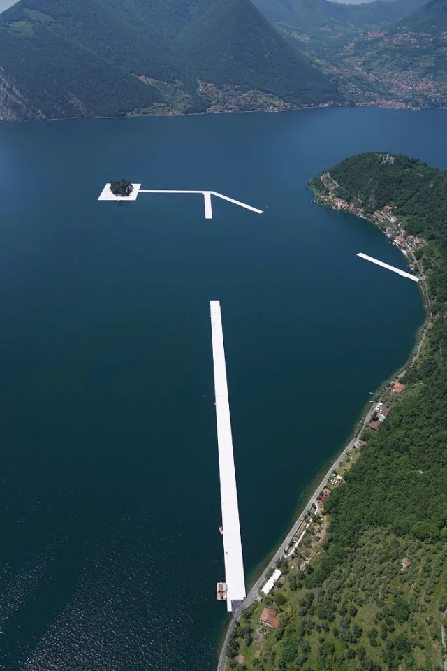 One by one, workers install the 100 by 16 meter sections to connect the island of San Paolo with the island of Monte Isola