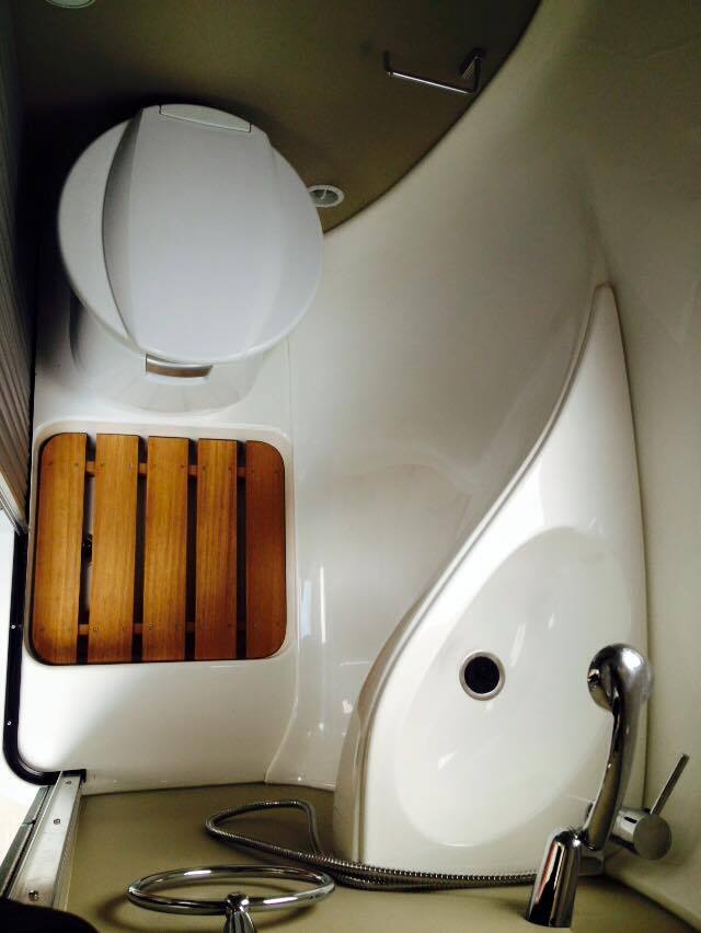 The bathroom took some work, but stylishly combines interior curves with all the equipment a bathroom needs