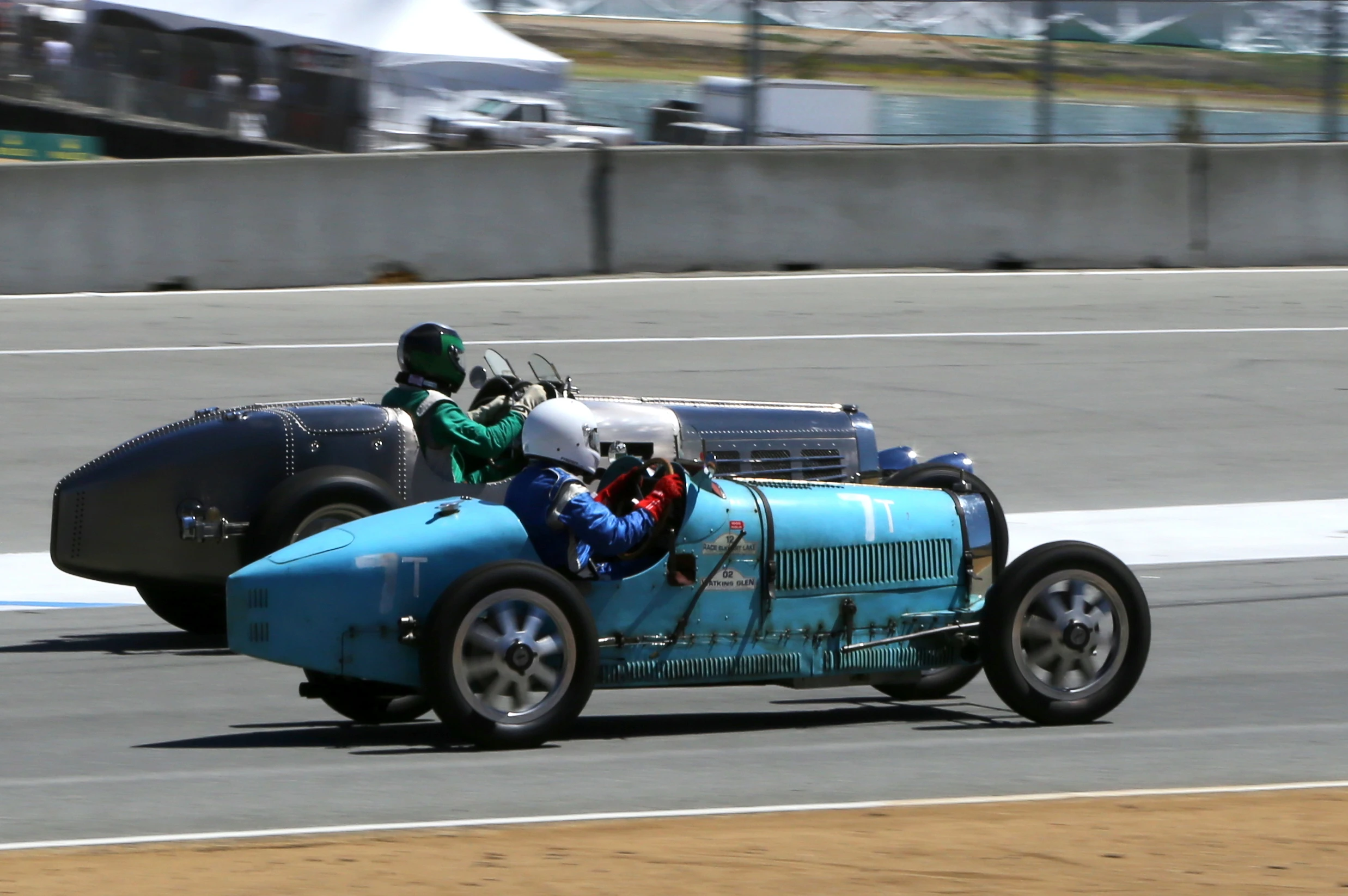 A rare sight, two Bugattis battle it out on the straight at Laguna Seca (Photo: Angus MacKenzie/Gizmag.com)