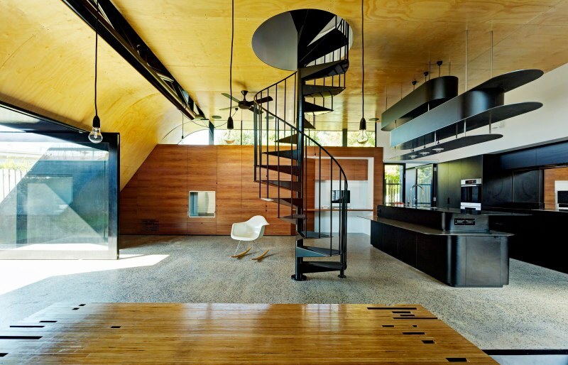 A spiral staircase in the center of the ground floor leads to the new master bedroom, bathroom and rooftop retreat