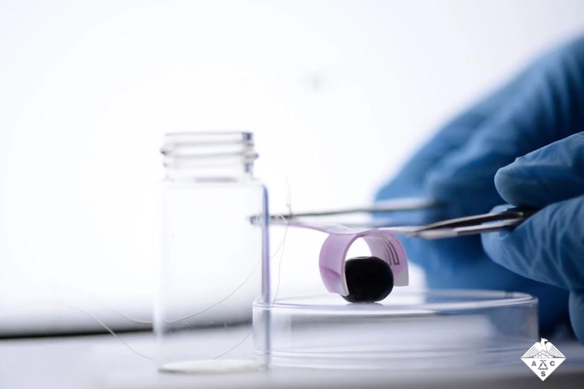 The prototype device is used to lift a delicate blueberry