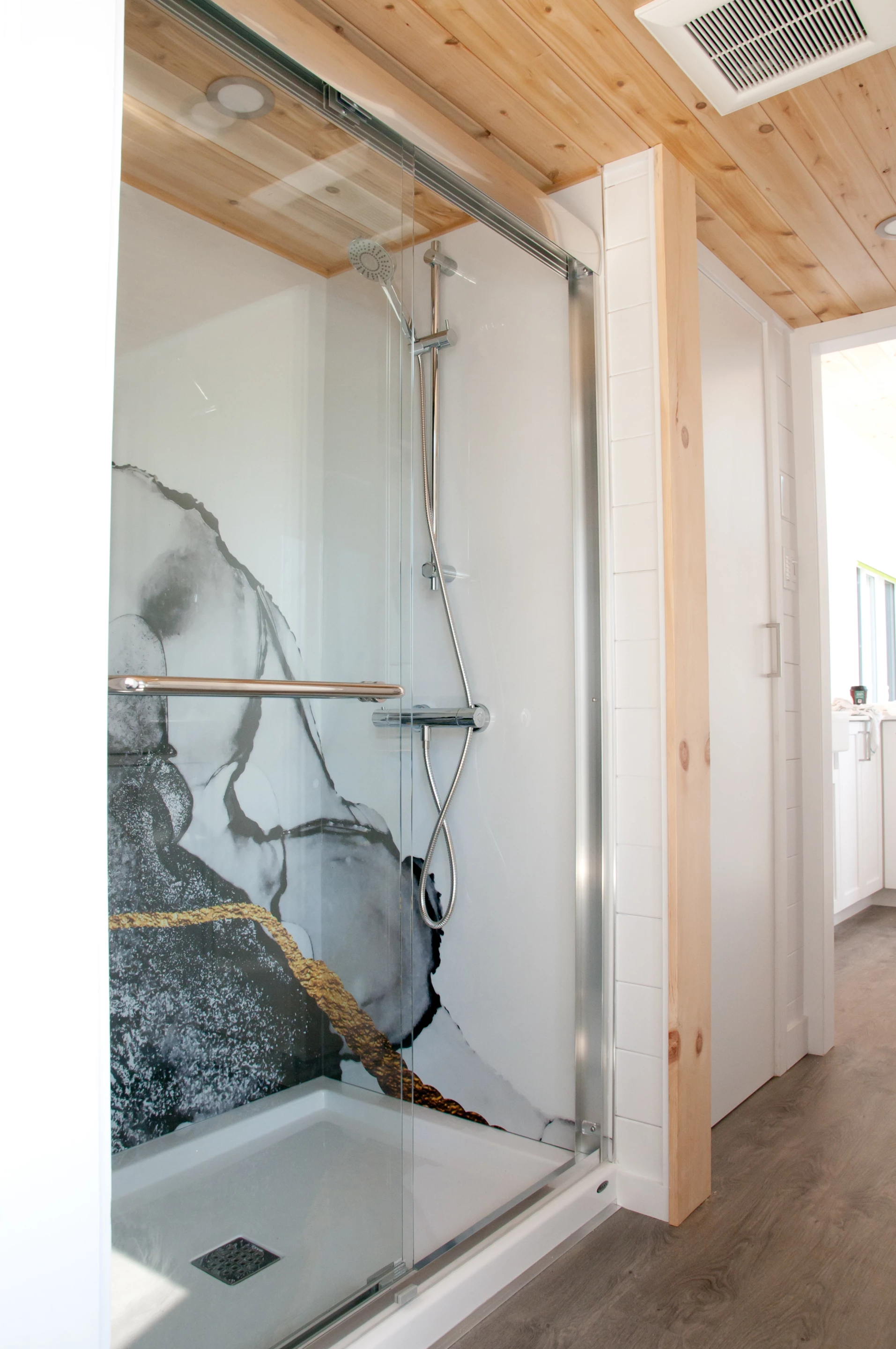 The Magnolia V5's shower has a decorative pattern inside