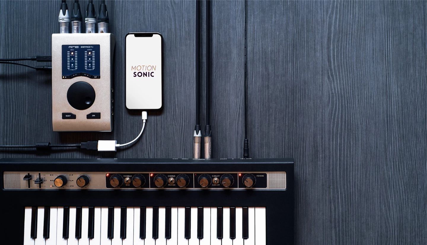 The Motion Sonic sensor works with an app running on an iPhone, which is cabled to an instrument via an audio interface