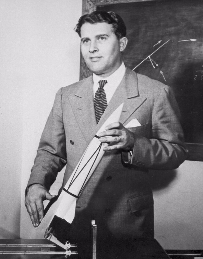 Werhner Von Braun and a model of his V-2 rocket