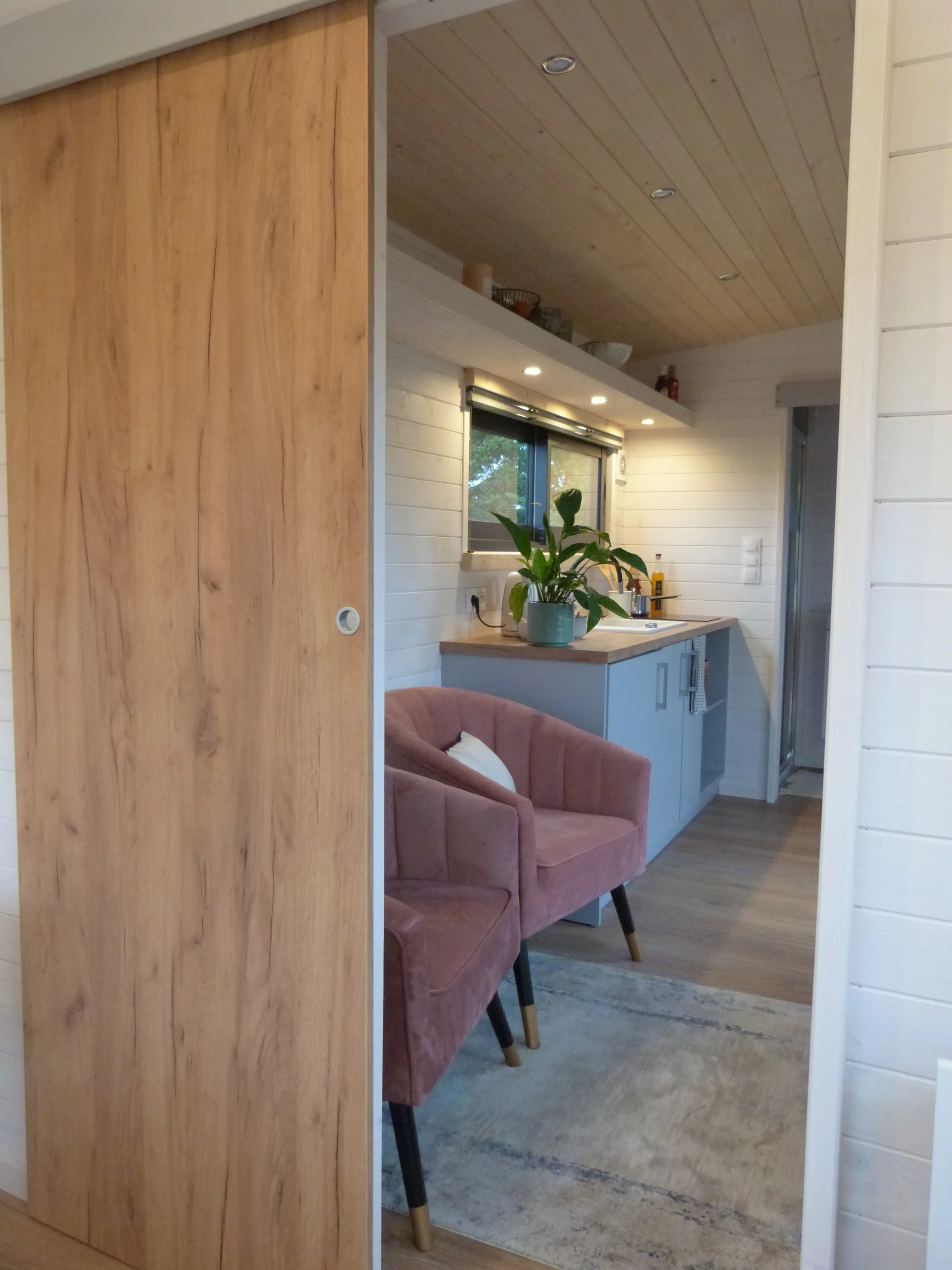 The Capucine's living area includes a couple of armchairs