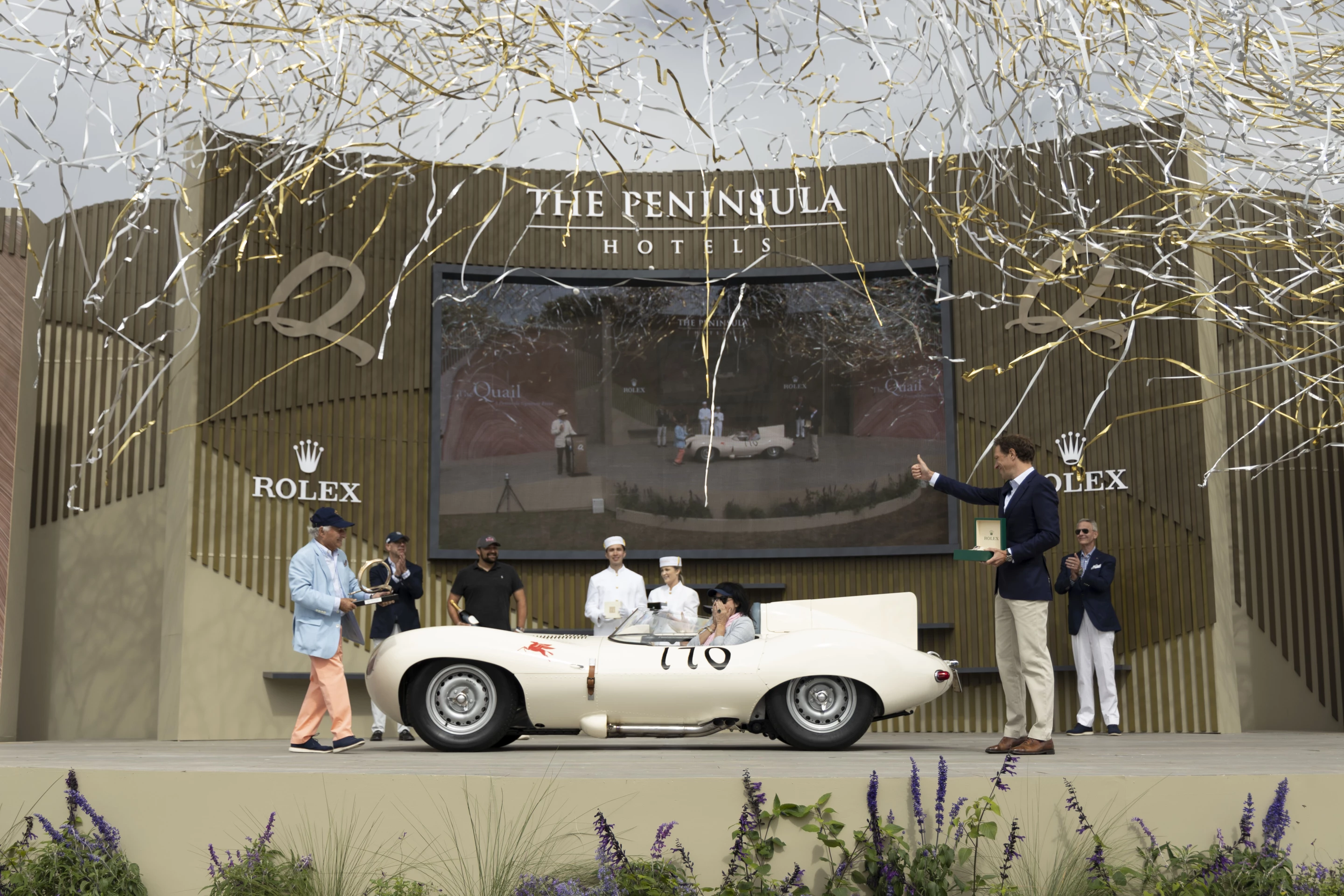 That's Sir Michael Kadoorie, one of the founders of the Peninsula Classics Best of the Best Award, presenting the Rolex Best of Show Award to Bill Pope for his Jaguar D-Type at the 2022 Edition of The Quail, A Motorsports Gathering (2022)