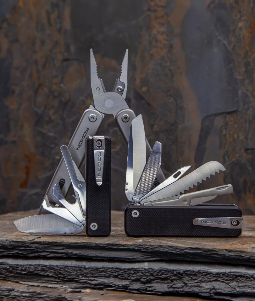 The new Mini Flex Companion (front left) can share its "Short" implement set with the slightly larger original Flex Companion (front right) and the full-size Flex multitool (back)