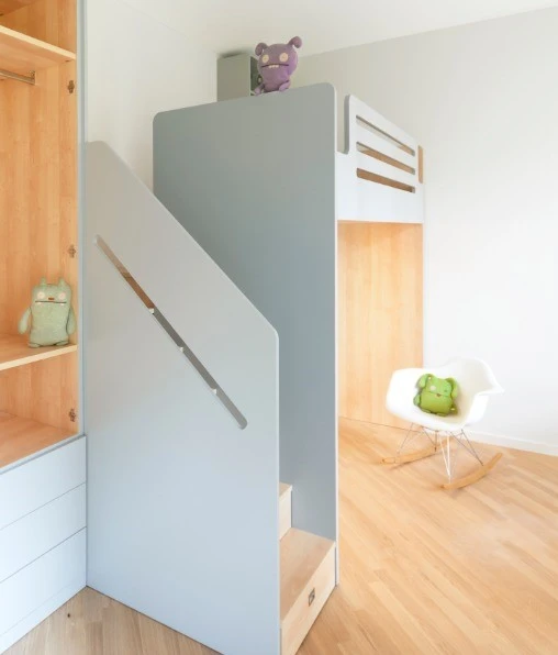 The children's playroom/bedroom boasts a custom-made wooden unit