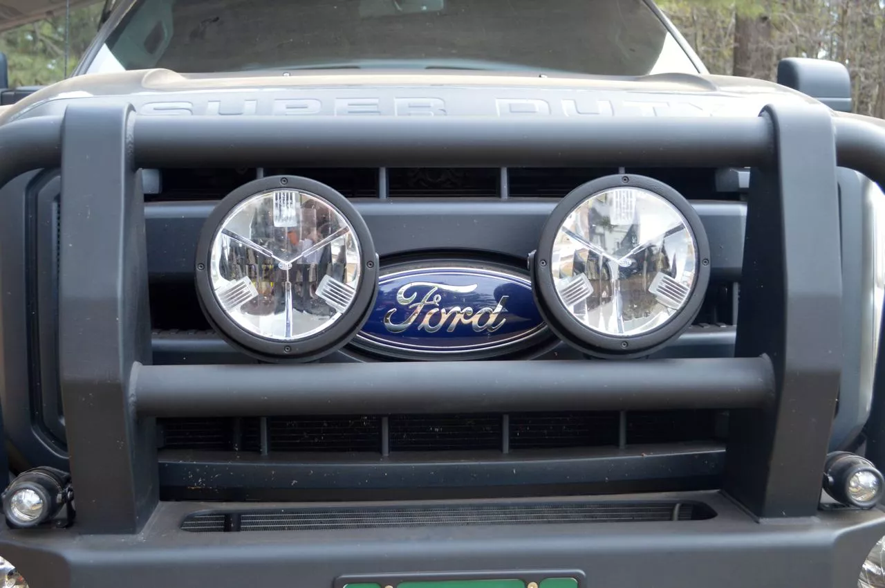 Off-road lighting mounted to the grille guard