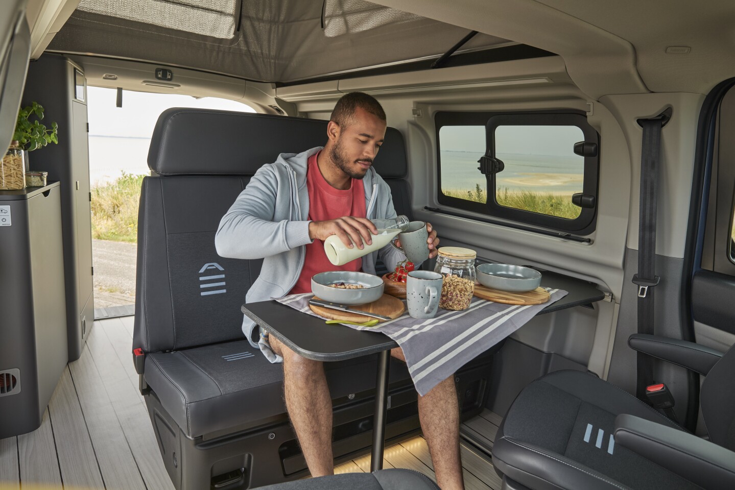 The Transit Nugget features a convertible front dining lounge, rear kitchen and pop-up sleeper roof