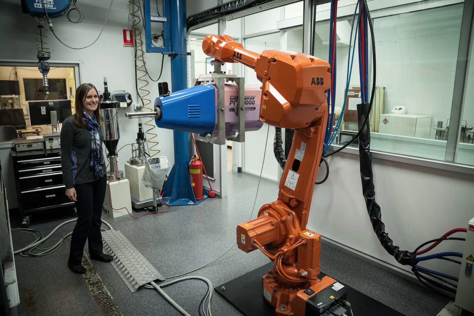 Lab 22's Alexandra Kingsbury with the group's Cold Spray Plasma Giken machine, mounted on a robot arm