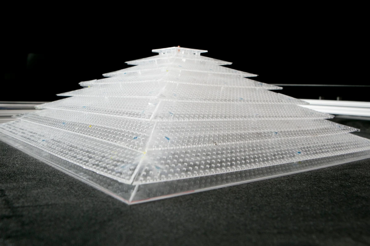 The acoustic cloak was constructed from several sheets of plastic plates dotted with repeating patterns of holes (Photo: Duke Photography)