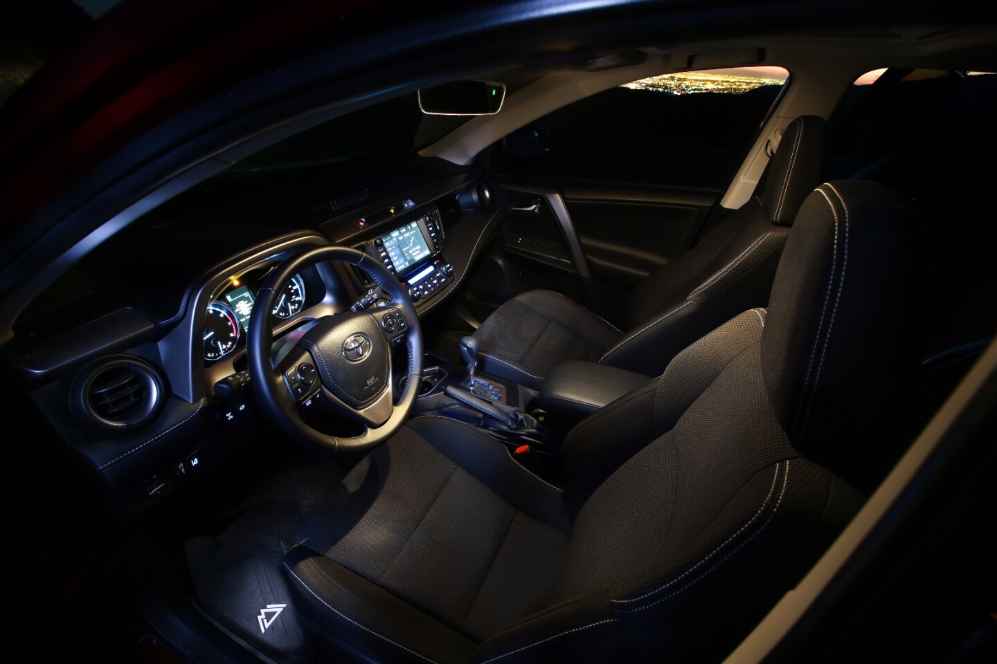 The interior includes a leather-wrapped shift knob, floor mats and other small upgrades