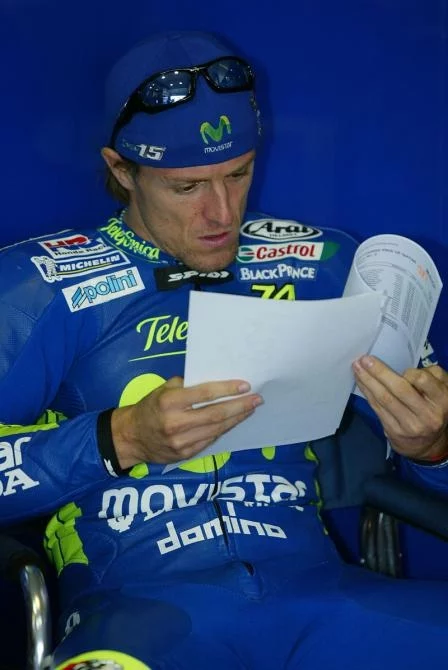 Gibernau studies the times - it is to be hoped that he can win a race this year or else it might be time to call in the sports psychologists