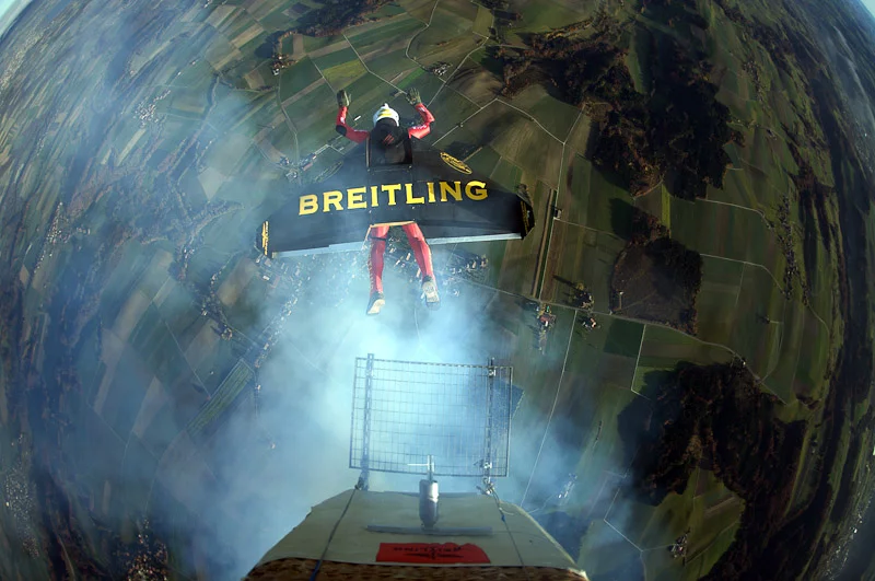 Swiss 'Jetman' Yves Rossy has successfully performed two aerial loops, using his unique strap-on jet-powered wing