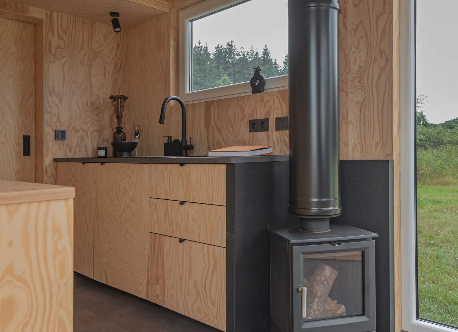 The BTH Loft off-grid includes a small wood-burning stove that should be sufficient for heating the home