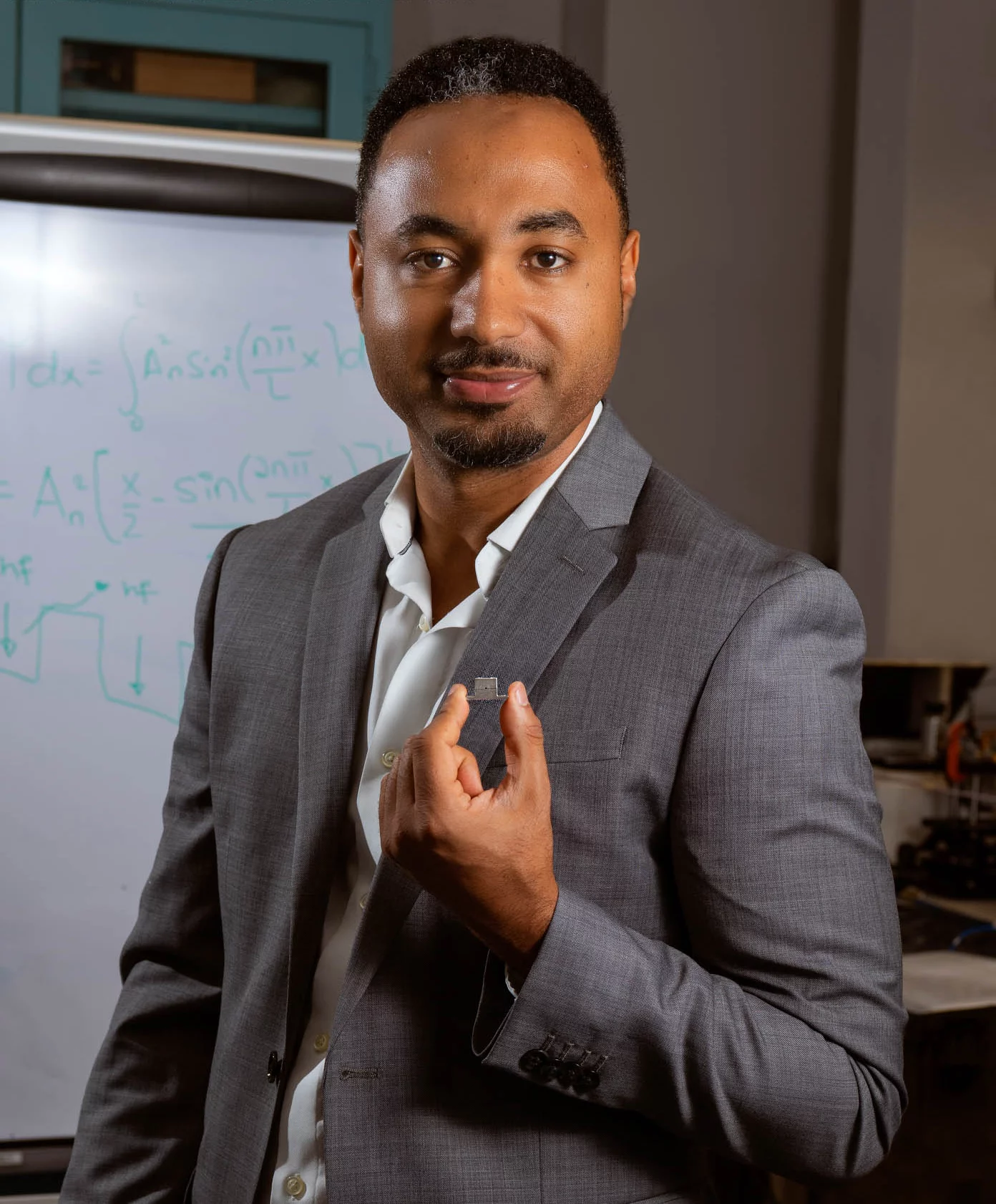Goddard engineer Berhanu Bulcha holds the tiny quantum cascade laser