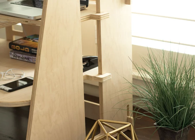The Perch desk uses hooks on the sides of its platforms to keep them steady