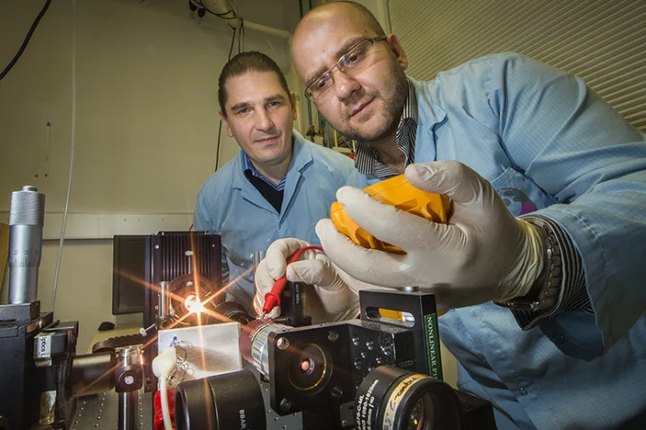 Researchers Andrey Miroshnichenko (left) and Mohsen Rahmani (right) demonstrate the new nanomaterial