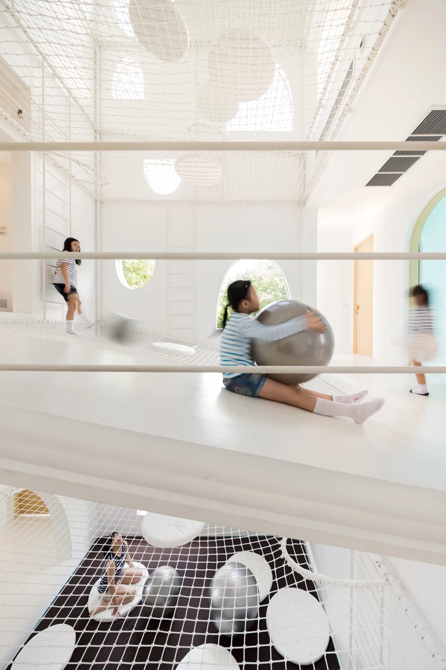 Kids can slide down slopes that are built into the Jerry House