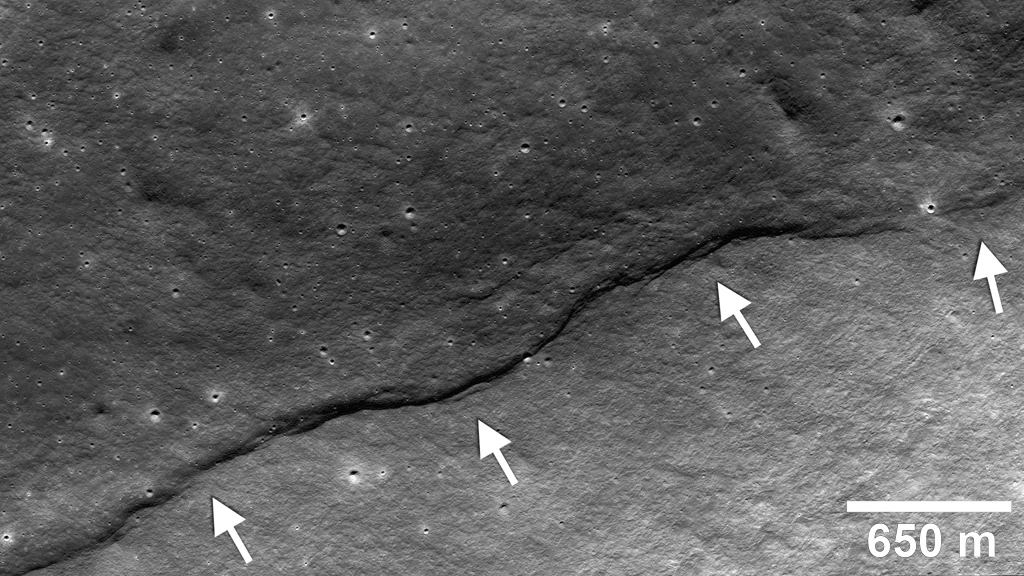 Image showing a thrust fault having pushed crustal materials (arrows) up the side of the farside impact crater named Gregory (Image: NASA/Goddard/Arizona State University/Smithsonian)