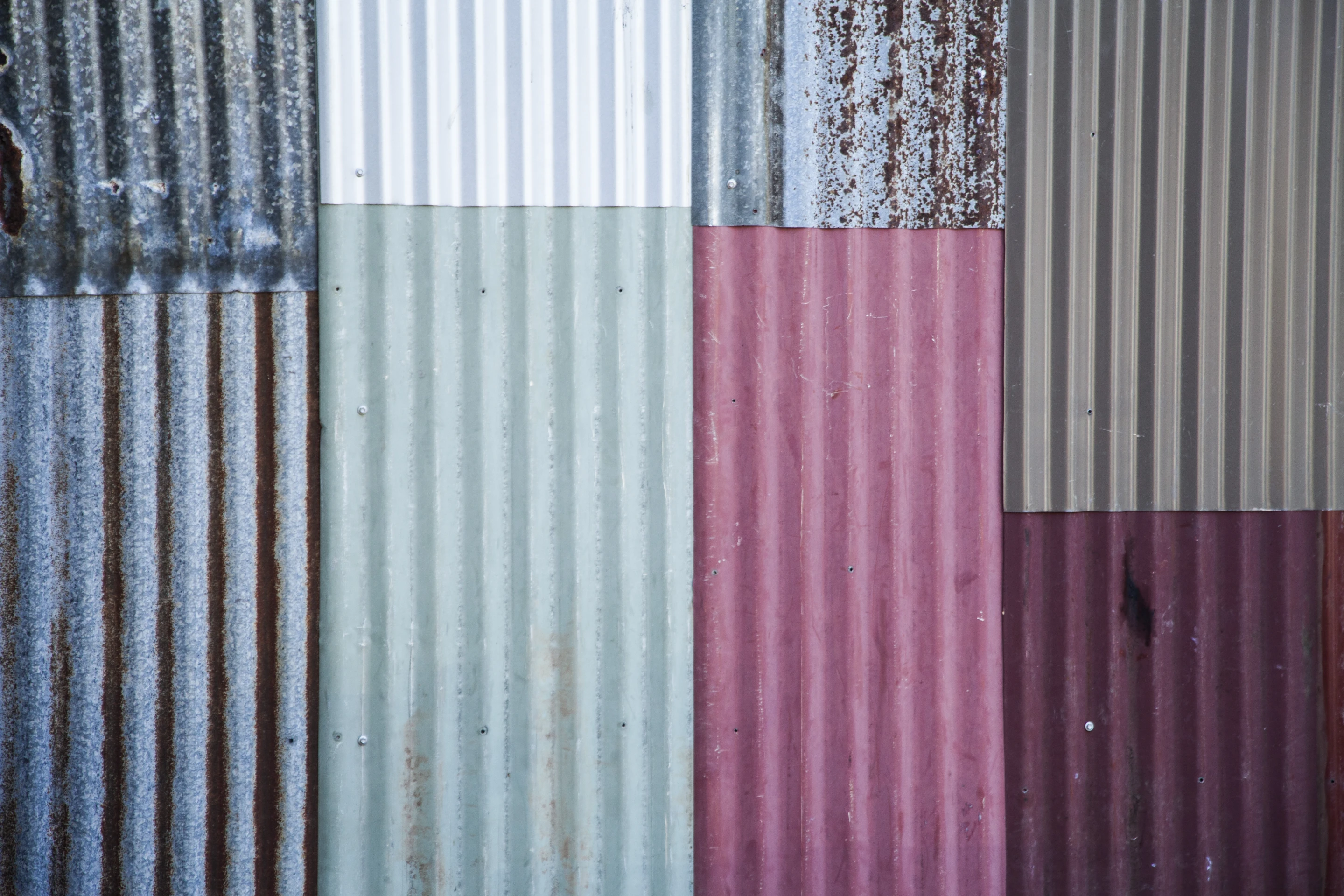 The exterior cladding is a hodgepodge of salvaged metal, cedar weatherboards, and fence palings (Photo: Alicia Fox Photography)