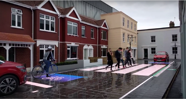 LEDs embedded into the road surface of the Starling Crossing light up to guide pedestrians across the street, while also instructing cyclists and vehicles to stop a safe distance away