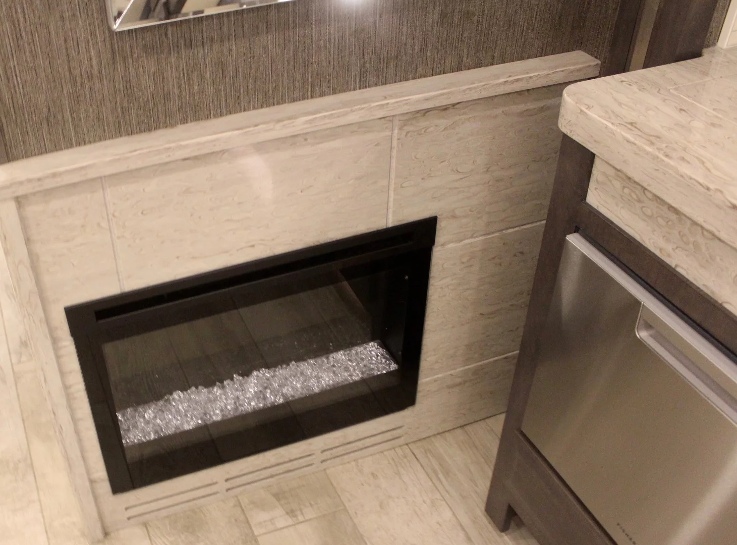 Anyone can enjoy a fireplace in the bedroom or living room, but how about the kitchen?