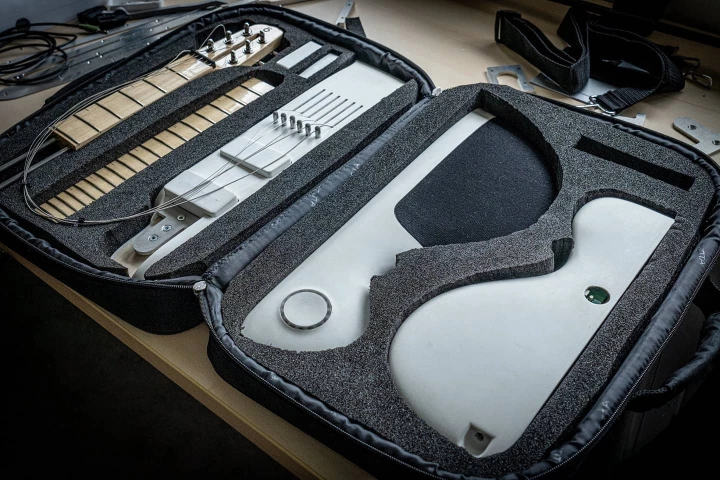 The Slite travel guitar breaks down into five parts for transport in a case about the same size as a laptop bag