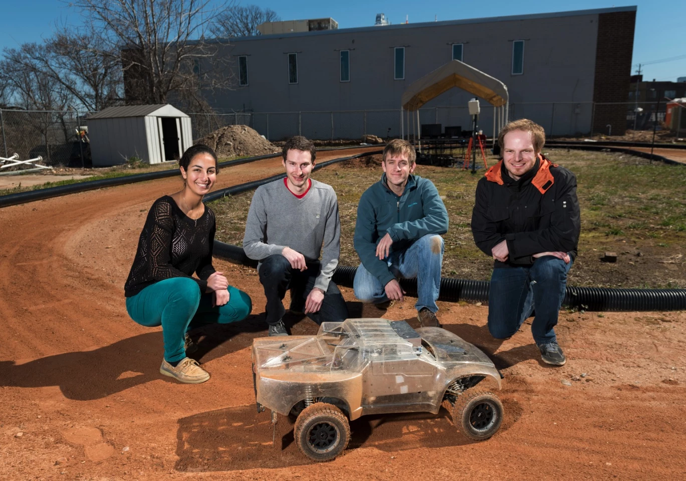 The team who created the car with their creation