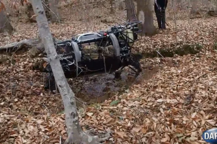 No worse for wear, DARPA's LS3 lands in a mud puddle during a training exercise from the fall, 2012