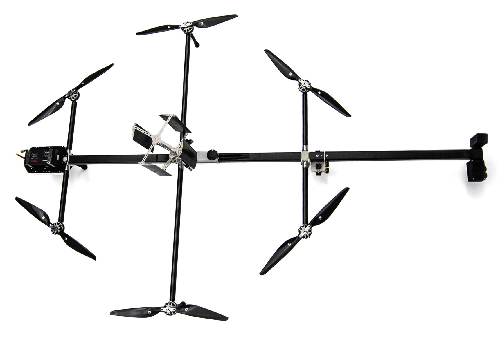 A relatively traditional hexacopter layout, but there's a long payload arm out way beyond the props on one and, a battery pack on the other end to balance, and a cyclorotor on top