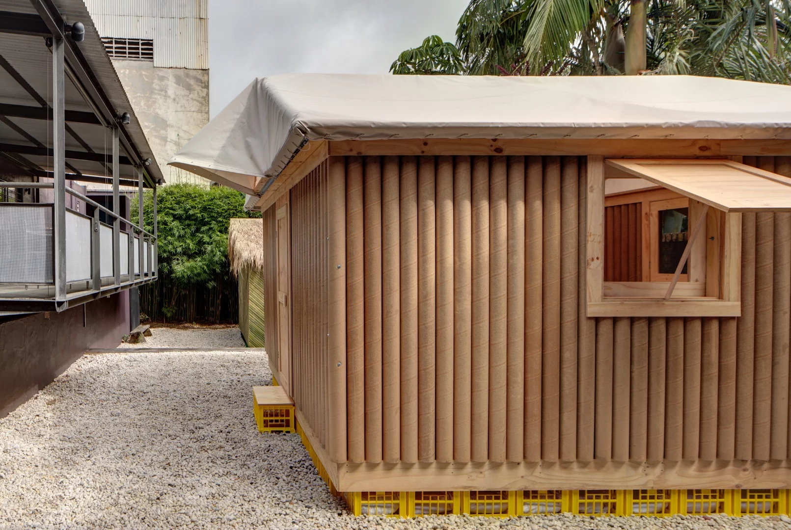 Highlighting Shigeru Ban's flair for using cheap and readily-available materials, the foundations consist of donated beer crates loaded with sandbags
