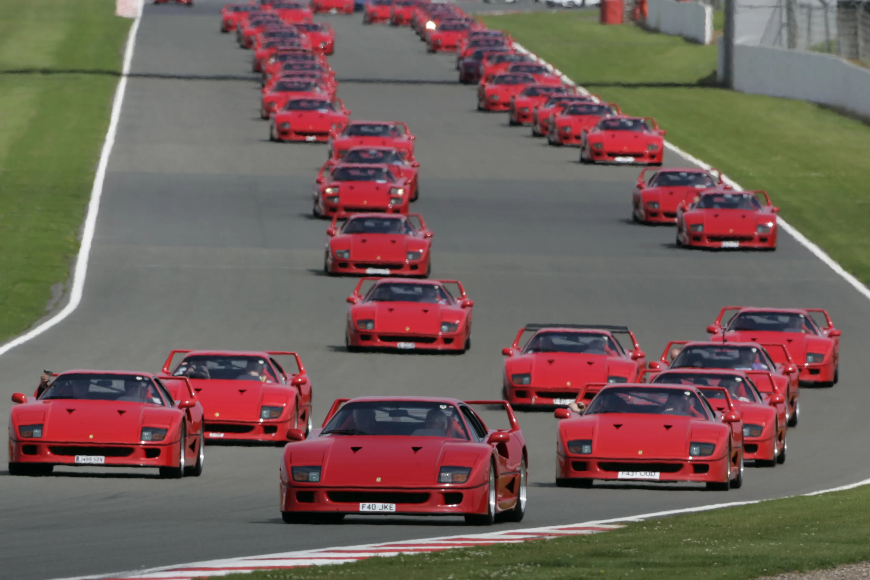The collection of 60 F40s make their way around the Silverstone circuit on the weekend