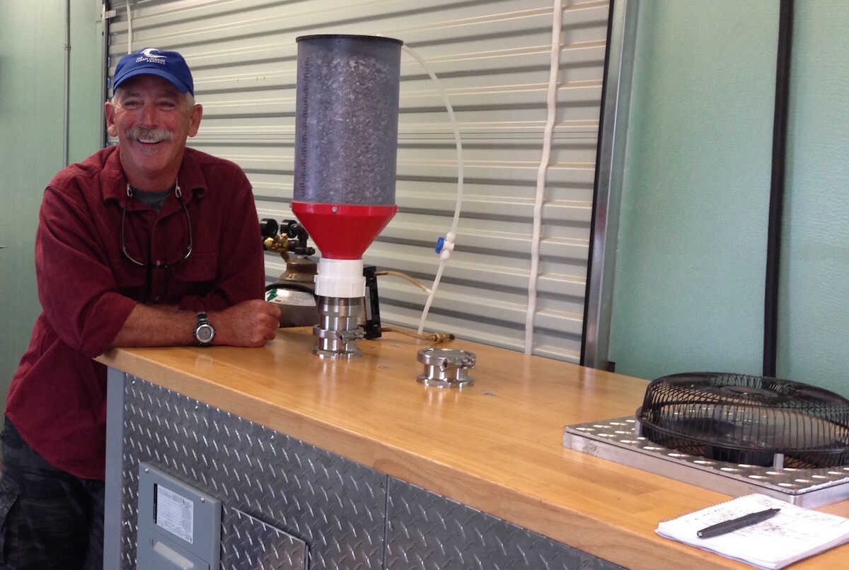 Sailor James Holm with the semi-portable pyrolysis reactor