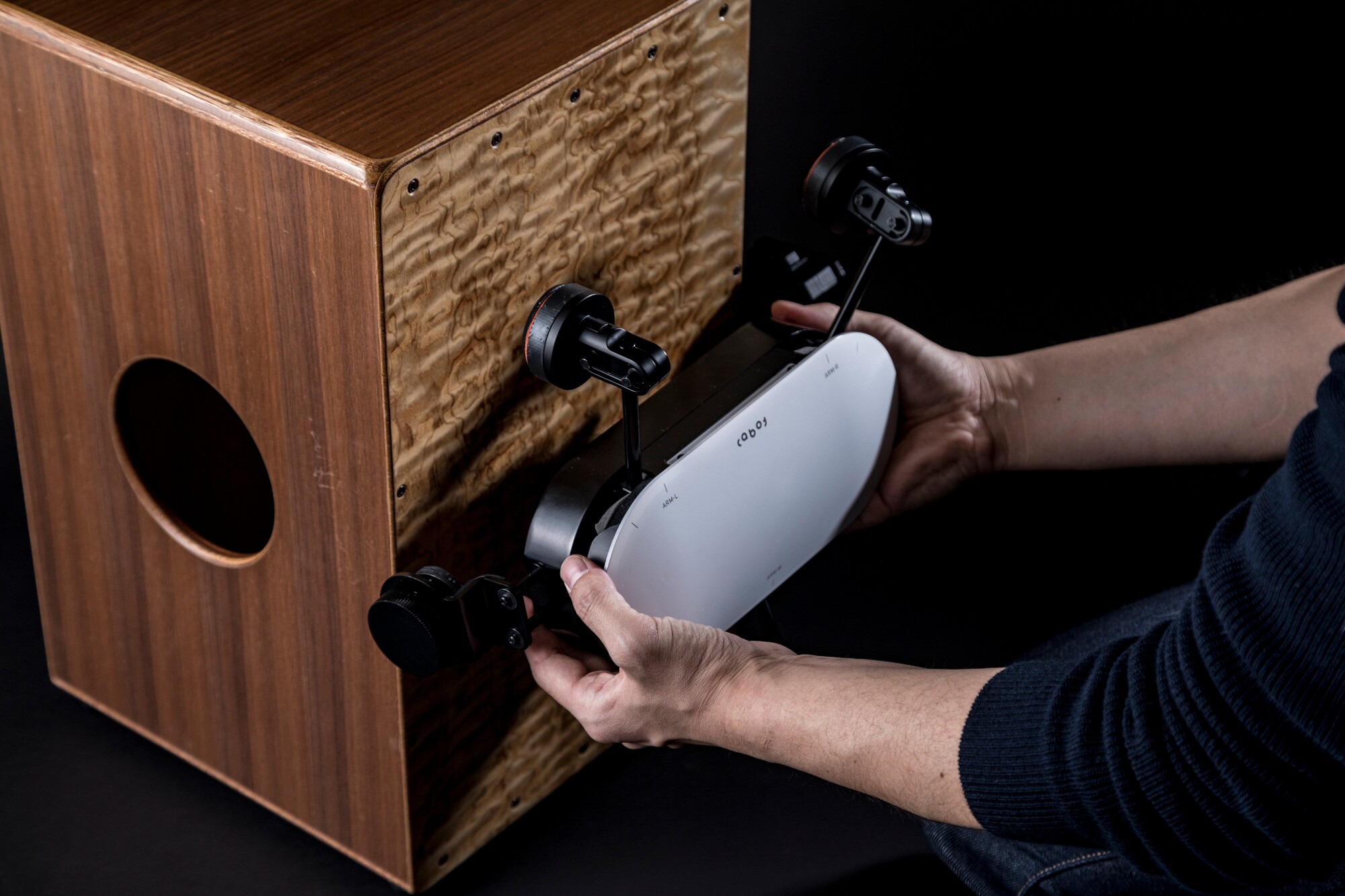 Cajon playing beatbot bashes out rhythms for solo performers