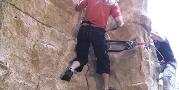Climbers clip their harnesses to the integrated cables for safety
