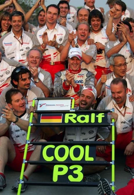 Ralf Schumacher celebrates third place