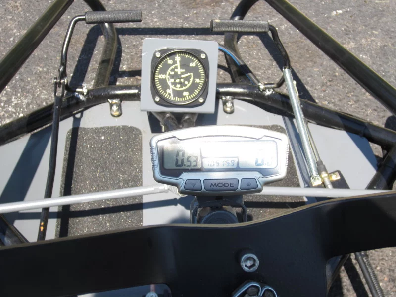 The kart's N1 gas producer tachometer (top) and digital speedometer