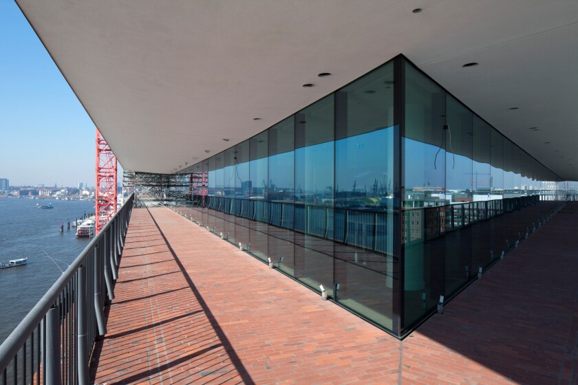 The plaza has a walkway around its edges that encircles the whole building