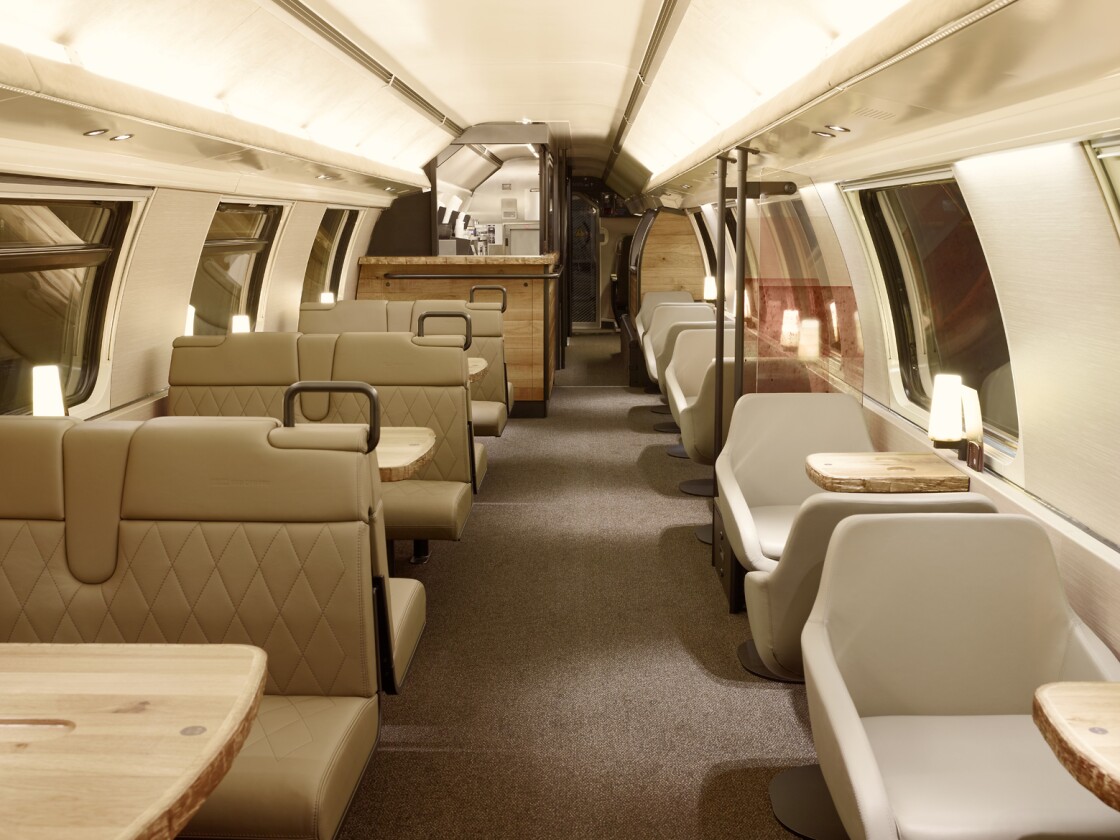 The chairs on the Starbucks carriage and covered in beige leather
