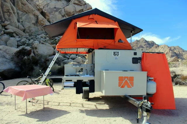 Mobilight Base Camp tent with shower on the right, kitchen on the left and roof-top tent up top